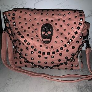 Pink studded handbag with crystal skull